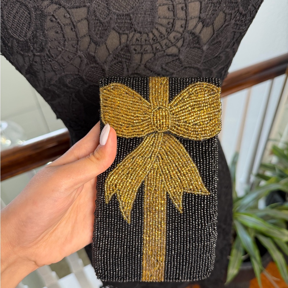 Chic Black Clutch with Gold Bow